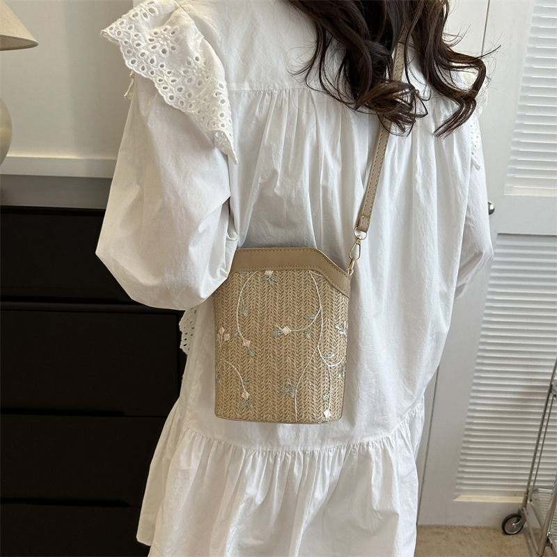 Bucket bag with rope braid material, zipper opening, bucket silhouette, internal cellphone pocket, inner patch pocket