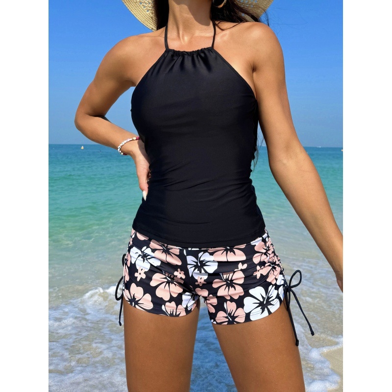 Двучастен женски бански, без ръкави, стил бриф; външна материя 82% полиестер, 18% еластан; подплата 95% полиестер, 5% еластан; подходящ за плуване и ходене във водата