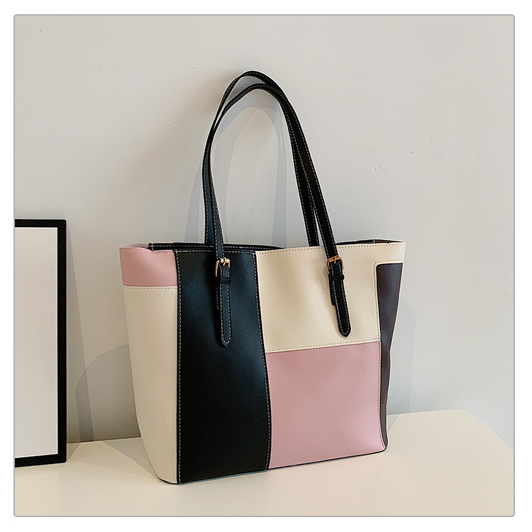 Városi egyszerűség stílusú tote táska, PU anyagból, belső nylon bélés, cipzáras zárás, függőleges négyszög alak, dupla vállpánt