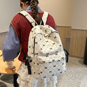 Női iskolatáska masnival és geometriai mintával | 20–35 L, 15 hüvelykes laptophoz, bővítő funkció, ívelt vállpántok