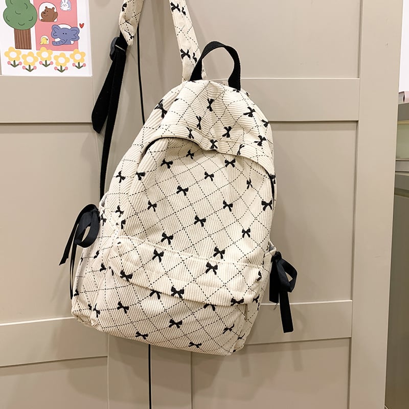 Női iskolatáska masnival és geometriai mintával | 20–35 L, 15 hüvelykes laptophoz, bővítő funkció, ívelt vállpántok