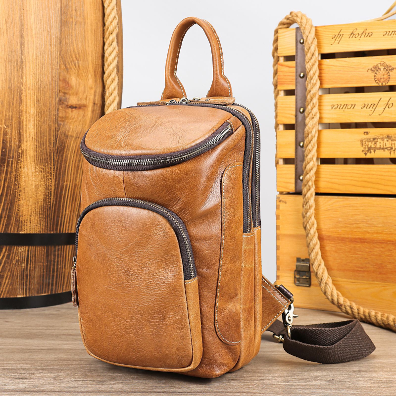 MAV ādas vīriešu krūšu somiņa, cilindriska forma, vienkrāsains raksts, poliesterā iekšpuse, nodilizturīga, paplašināma