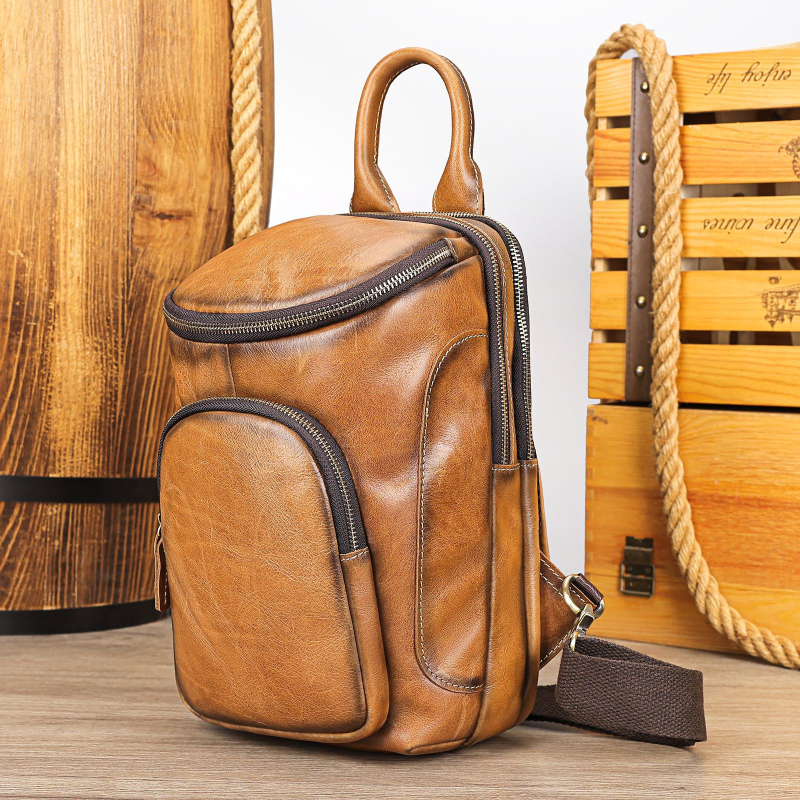 MAV ādas vīriešu krūšu somiņa, cilindriska forma, vienkrāsains raksts, poliesterā iekšpuse, nodilizturīga, paplašināma