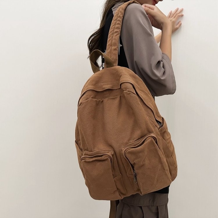 Kanvas ruksak u gradskoj jednostavnosti, s zip zatvaračem, pretincem za prijenosno računalo i unutarnjim slojem