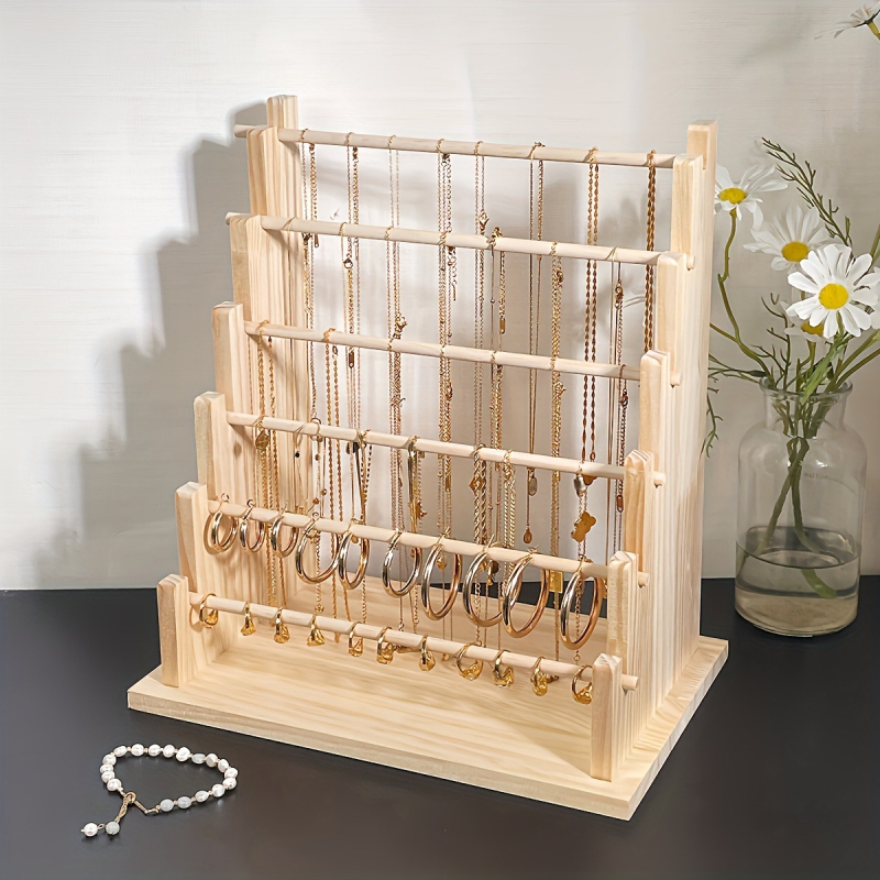 Masīva koka rokassprādžu un juvelierizstrādājumu displeja statīvs — četrstāvu kāpņu rāmis, šuvju darbs, pavasaris 2024