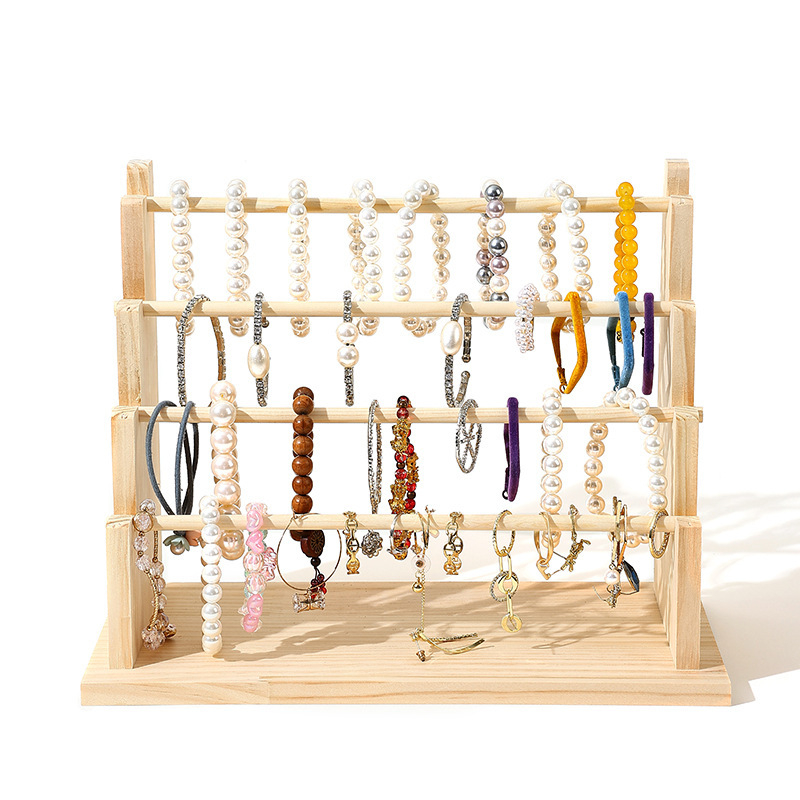 Masīva koka rokassprādžu un juvelierizstrādājumu displeja statīvs — četrstāvu kāpņu rāmis, šuvju darbs, pavasaris 2024