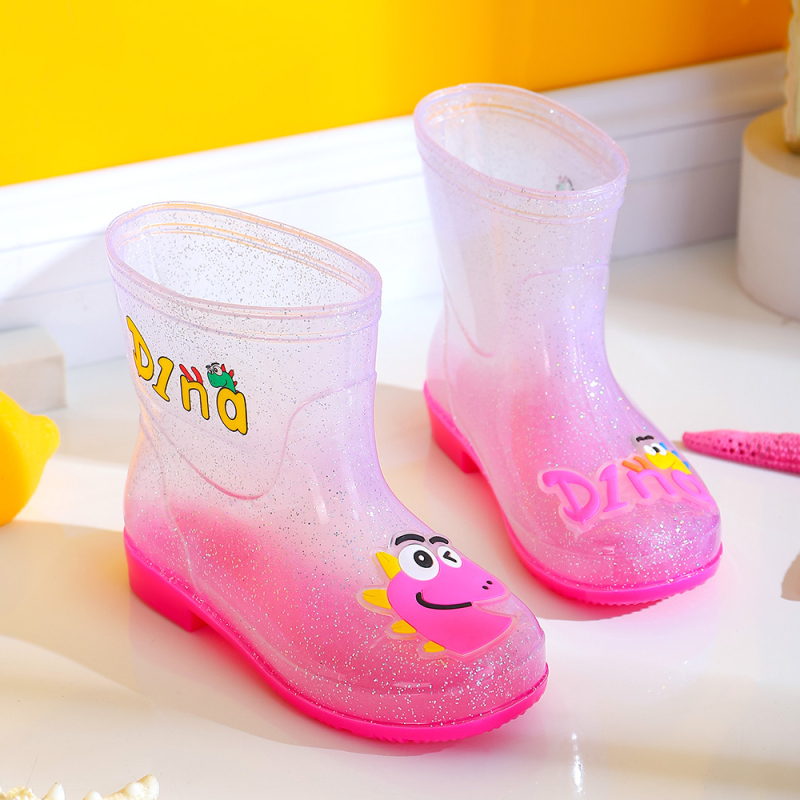 Bērnu lietuss zābaki - PVC augšdaļa, vidējā caurules augstums, zems papēdis 1–3 cm, burti-dinozaura raksts, animācijas stils