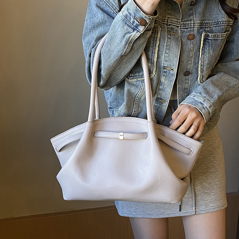 PU ženska torba kružnog oblika, zatvaranje na zip, unutarnji džep za mobitel, dvije naramenice