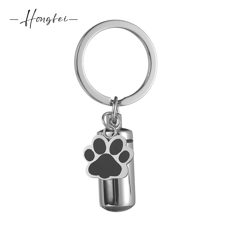 Rozsdamentes acél kulcstartó kapszula medve mancs formájú mintával, nyitható