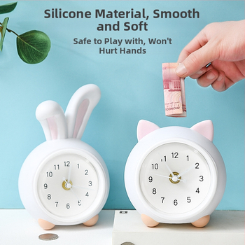 Vaikų stalo laikrodis su taupymo dėžute ir naktiniu apšvietimu, baterijomis maitinamas mechaninis judesys, vienpusis plastikinis korpusas, animacinio stiliaus