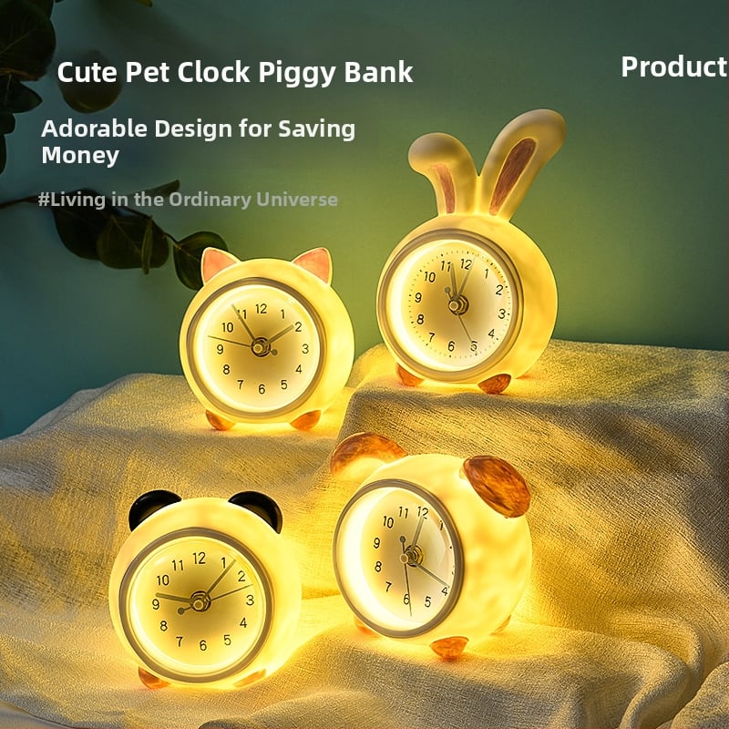 Vaikų stalo laikrodis su taupymo dėžute ir naktiniu apšvietimu, baterijomis maitinamas mechaninis judesys, vienpusis plastikinis korpusas, animacinio stiliaus