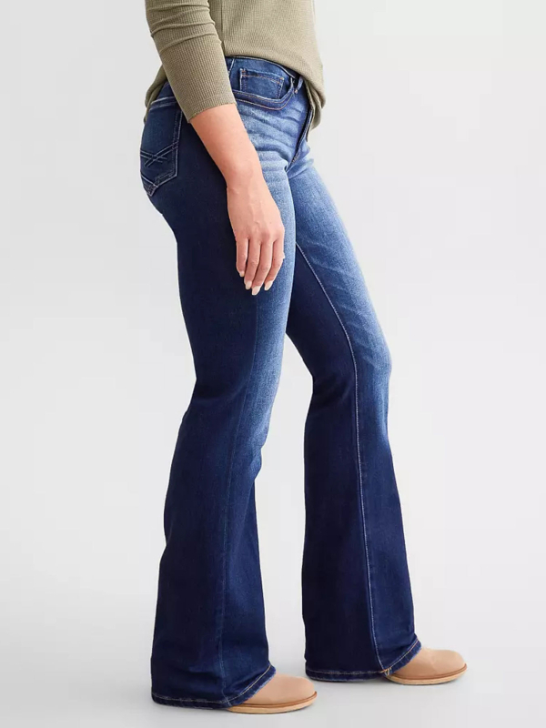 Moteriški džinsai iš džinsinio audinio, vidutinio juosmens, elastiniai, su įtrūkimais, šiek tiek platėjantys keliai, medvilnės-poliesterio mišinys (50–70% medvilnės, <30% poliesterio)