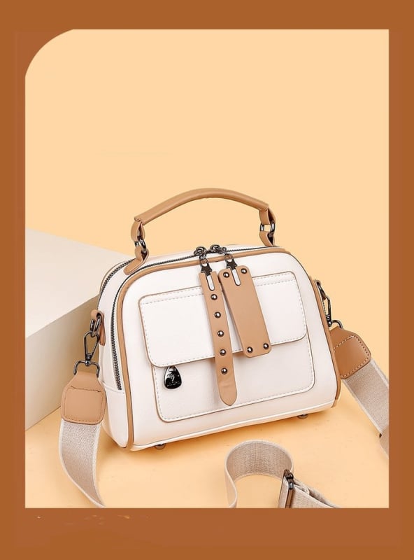 PU kvadratinė pečių krepšys su metaliniais detalėmis, užtrauktukas, poliesterio padas; vidinės kišenės: užtrauktukinė kišenė, telefono kišenė, ID kišenė; vienas pečių diržas; horizontali kvadrato forma.