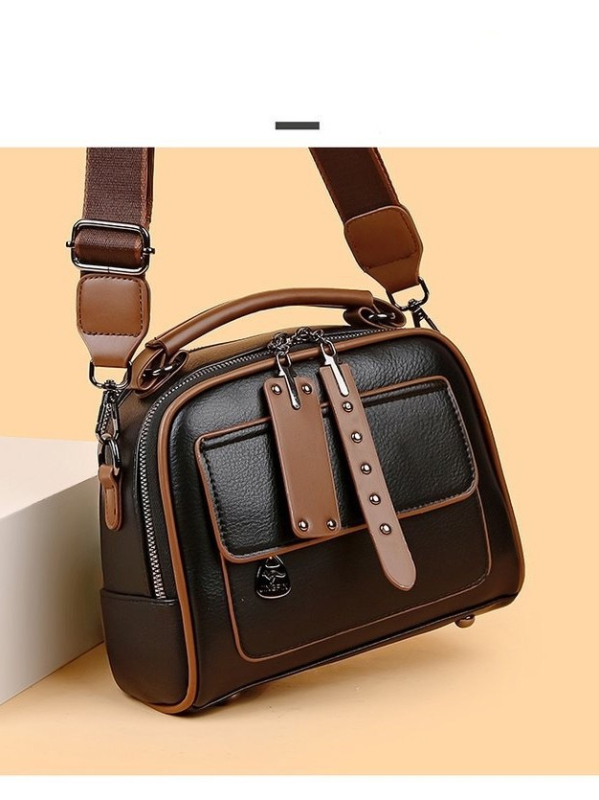 PU kvadratinė pečių krepšys su metaliniais detalėmis, užtrauktukas, poliesterio padas; vidinės kišenės: užtrauktukinė kišenė, telefono kišenė, ID kišenė; vienas pečių diržas; horizontali kvadrato forma.