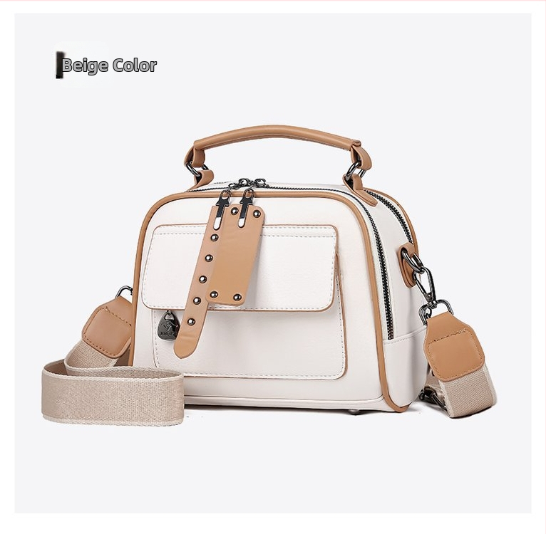 PU kvadratinė pečių krepšys su metaliniais detalėmis, užtrauktukas, poliesterio padas; vidinės kišenės: užtrauktukinė kišenė, telefono kišenė, ID kišenė; vienas pečių diržas; horizontali kvadrato forma.