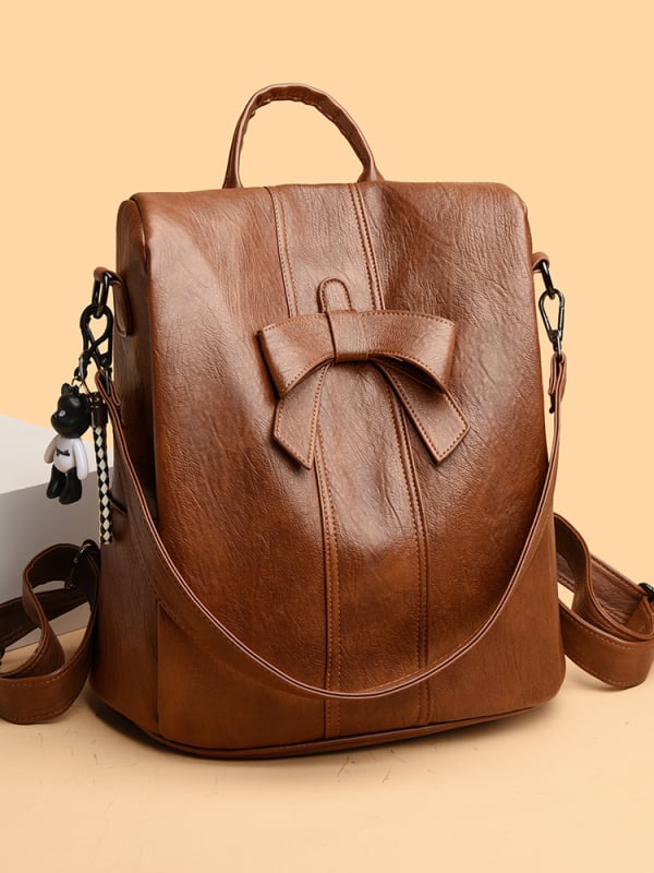 Rucsac cu nod de panglică, anti-furt, pentru călătorii; exterior PU, căptușeală poliester; închidere cu fermoar; buzunare interioare pentru laptop, ID și organizare; impermeabil