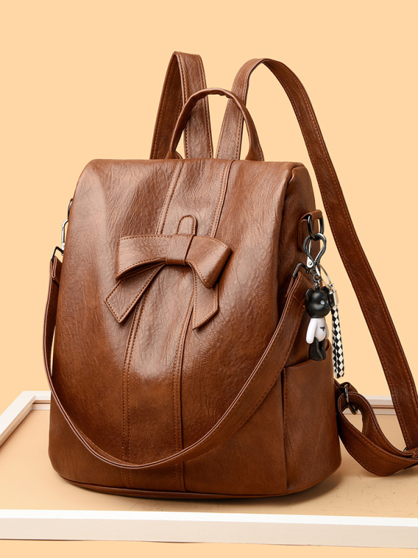 Rucsac cu nod de panglică, anti-furt, pentru călătorii; exterior PU, căptușeală poliester; închidere cu fermoar; buzunare interioare pentru laptop, ID și organizare; impermeabil