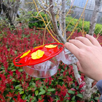 Aštuonkampė kolibrių vandens šėrimo kanalas su kabamu gėlių vamzdelio dizainu; Medžiaga: Kita; Kilmė: Hebei; Skirta paukščiams.