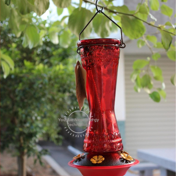 Kolibrio lesyklė - lauke pakabinama, raudono stiklo su geležies dalimis, automatinis maitinimas; medžiagos: stiklas, plastikas, geležis; kilmė: Quanzhou