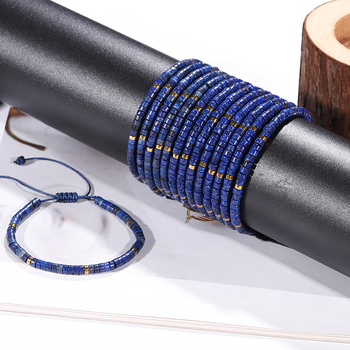 Természetes lazisz lazuli gyöngyökkel készült karkötő, görgő formájú gyöngyökkel és spacerrel, szőtt zsinórral, kézzel készített.