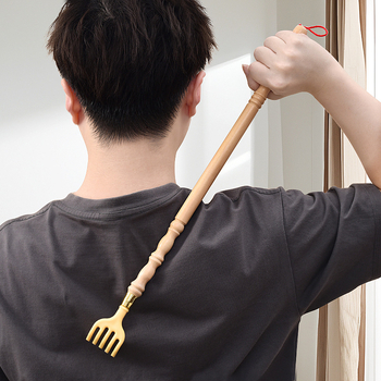 Nugaros šepetėlis – rankinis medinis/bambukinis įrankis nugarai (Funkcija: nugaros įbrėžimas; Medžiaga: medis/bambukas)