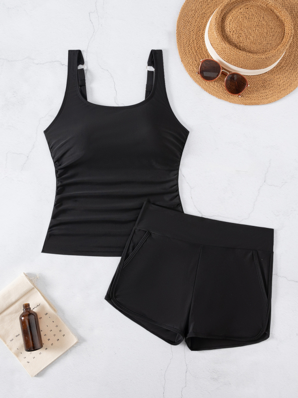 Set Tankini fără mânece, decolteu pătrat; top cu buzunar lateral și pernă pentru bust, fără suport metalic; material: nylon 82% cu căptușeală poliester; partea inferioară: slip tip briefs.