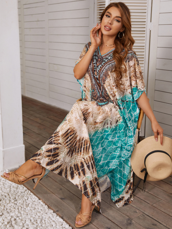 Rochie-cover-up de plajă cu imprimeu floral; material poliester-elastan cu uscare rapidă; guler rotund; mâneci batwing; talie lejeră