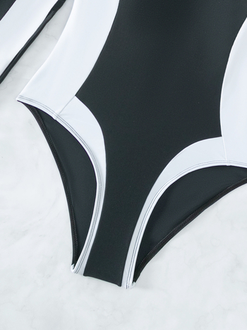 Μαγιό ολόσωμο με μακριά μανίκια, ψηλή μέση, ύφασμα πολυεστέρα που στεγνώνει γρήγορα, επένδυση πολυεστέρα και ελαστάνη 18%