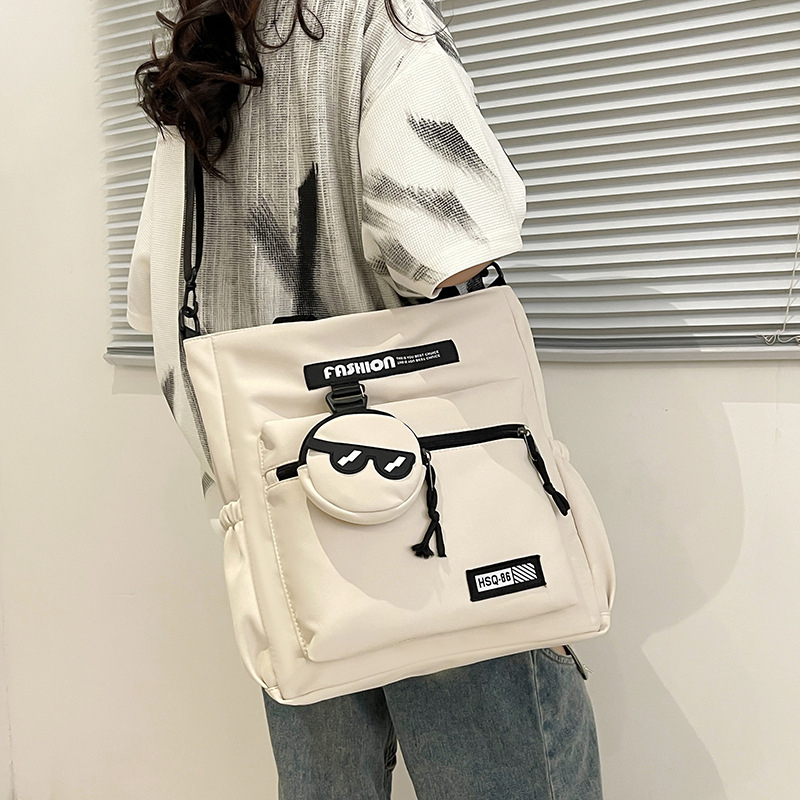 Lányoknak szóló egyvállas keresztpántos iskolai táska – nejlon, kopásálló, bővíthető kapacitás, terheléscsökkentés, kompakt tárolásra