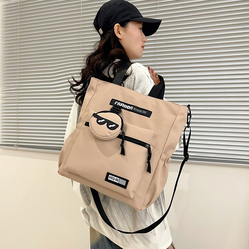 Lányoknak szóló egyvállas keresztpántos iskolai táska – nejlon, kopásálló, bővíthető kapacitás, terheléscsökkentés, kompakt tárolásra