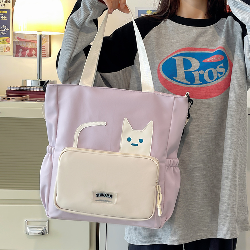 Lányoknak szóló egyvállas keresztpántos iskolai táska – nejlon, kopásálló, bővíthető kapacitás, terheléscsökkentés, kompakt tárolásra