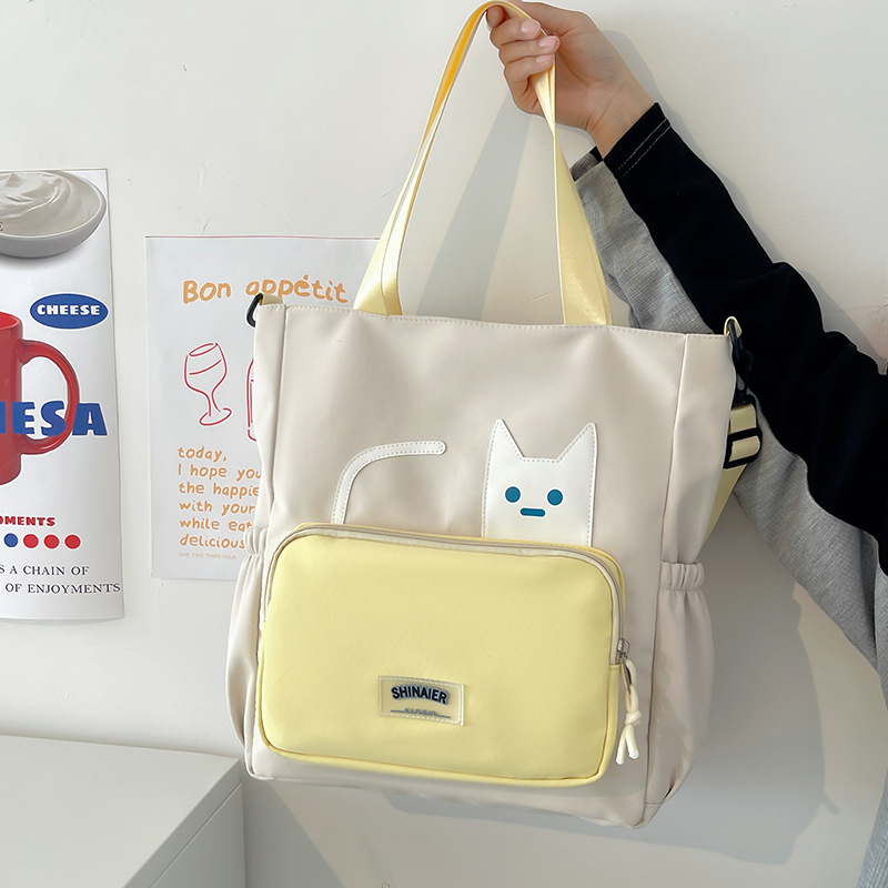 Lányoknak szóló egyvállas keresztpántos iskolai táska – nejlon, kopásálló, bővíthető kapacitás, terheléscsökkentés, kompakt tárolásra