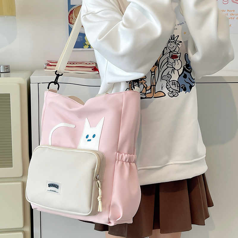 Lányoknak szóló egyvállas keresztpántos iskolai táska – nejlon, kopásálló, bővíthető kapacitás, terheléscsökkentés, kompakt tárolásra