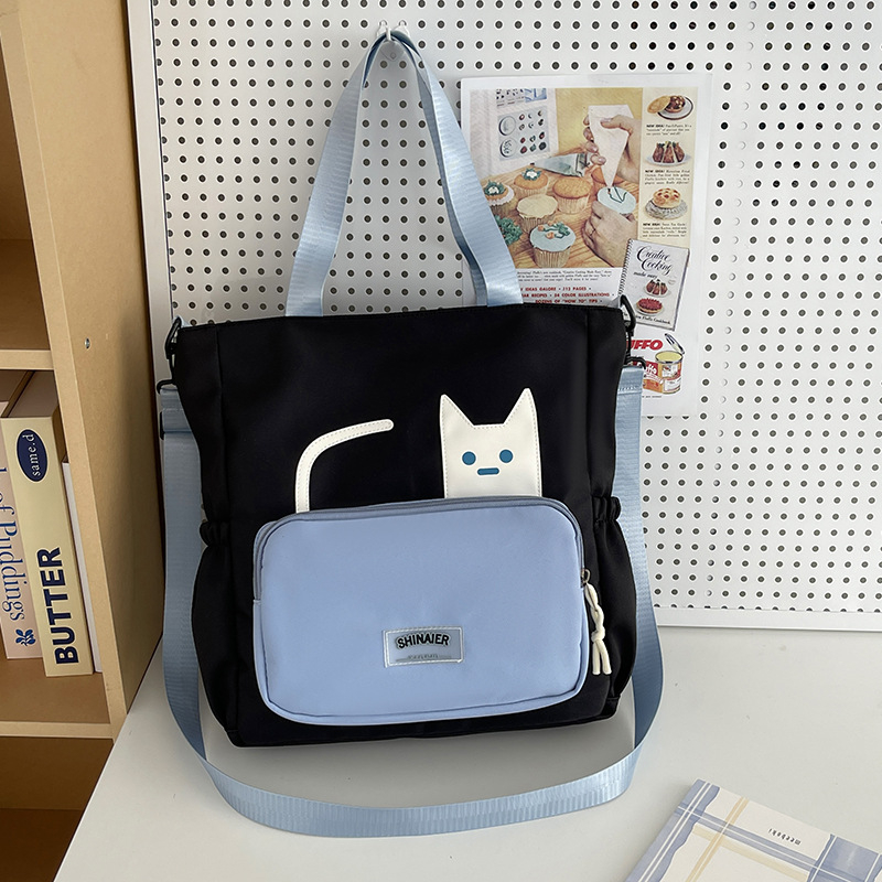 Lányoknak szóló egyvállas keresztpántos iskolai táska – nejlon, kopásálló, bővíthető kapacitás, terheléscsökkentés, kompakt tárolásra