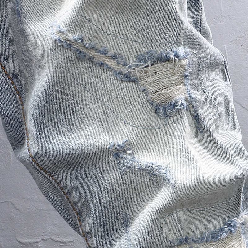 Muške traperice u korejskom stilu, uski kroj, distresirani efekt, mikroelastičnost, pet džepova, zip zatvarač, srednja visina struka, denim