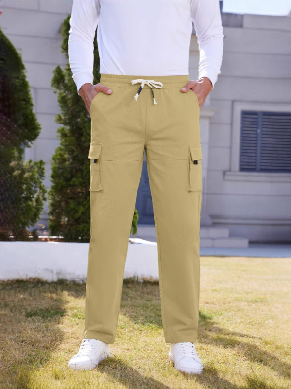 Meeste kerge polüesterist kootud tööpüksid, nelja aastaaja kandmiseks, vabaaja- ja sportlik stiil, keskmise tõusuga vöökoht, triikimata