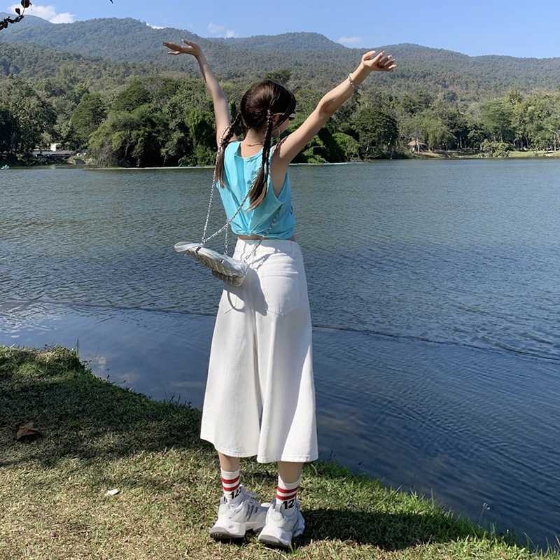 Magas derekú, széles szárú farmernadrág, Capri hosszúságú, pamut 80–90% és poliészter, városi stílus, tavasz 2025