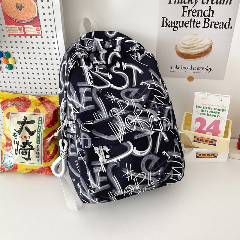 Lányok iskolai hátizsák – ultrakönnyű, nagy kapacitású, nylonból, légpárnás vállpántokkal, poliészter bélés, betűmintás dizájn, iskola használatra