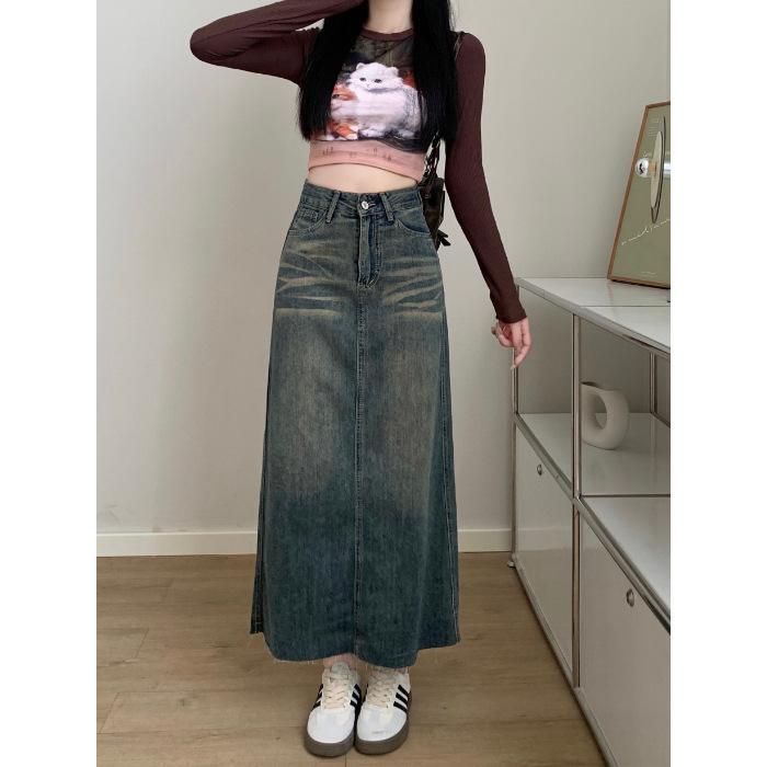 Ženska traper suknja, visokim strukom, A-linija, srednje duljine, obrub na kraju, sastav: pamuk 50–70%, poliester 30–50%