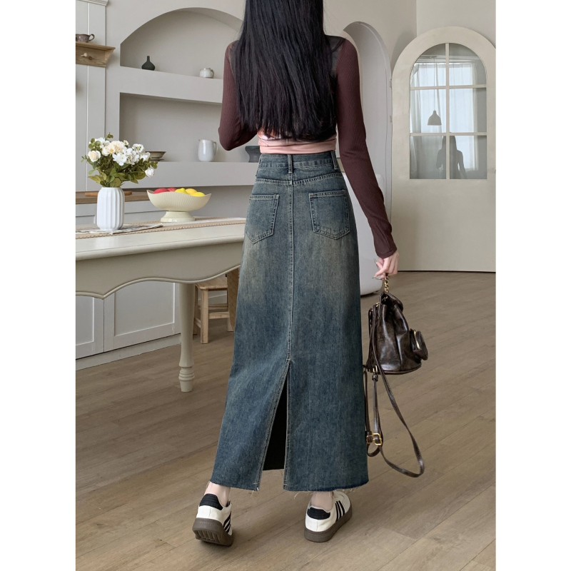 Ženska traper suknja, visokim strukom, A-linija, srednje duljine, obrub na kraju, sastav: pamuk 50–70%, poliester 30–50%