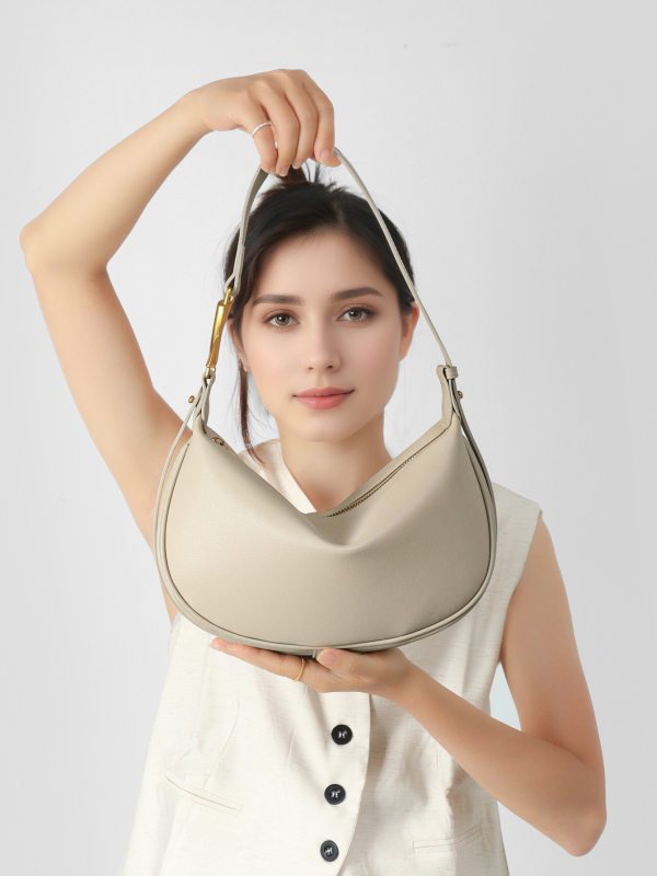 Moon crossbody τσάντα — γνήσιο δέρμα, αστικός μινιμαλισμός, σχήμα dumpling, άνοιγμα με φερμουάρ, επένδυση από δέρμα βοδιού