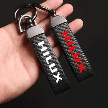 Raktų dangtelis Toyota Hilux Prado modeliams – ultrafininė pluošto oda, anglies pluošto tekstūra, minimalistinis stilius, 360° sukimas, pritaikomas