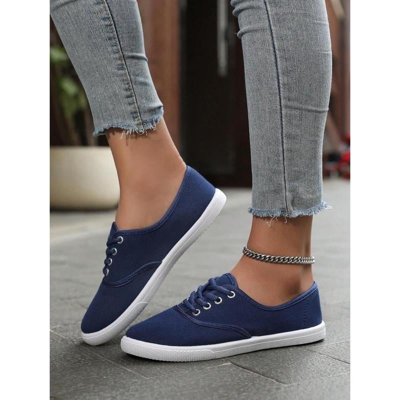 Ženske mules s gornjim dijelom od rafije, vunena podstava, okrugli nos, prugasti uzorak