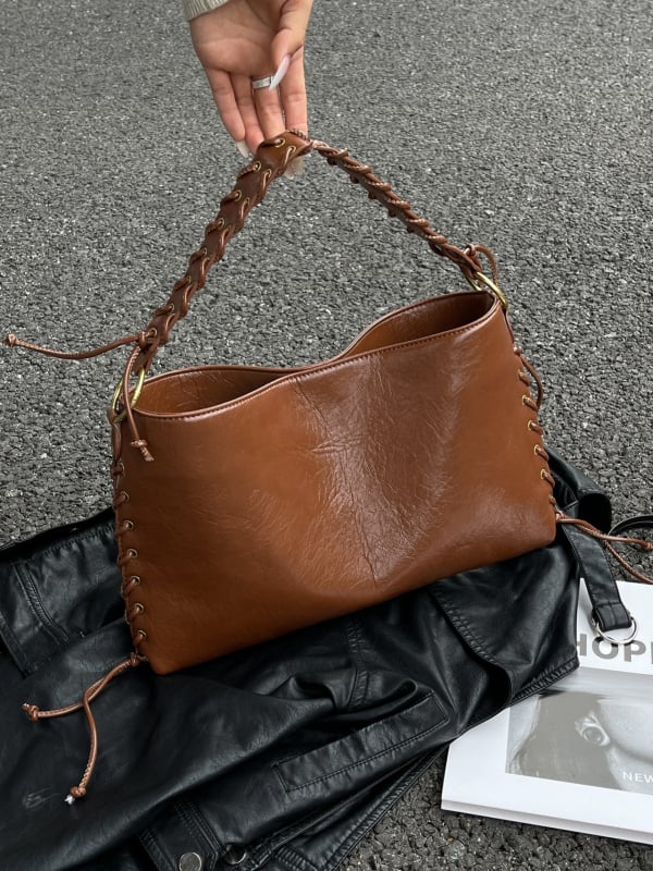 2025 őszi-téli tote táska fém szemdíszítéssel, nagy kapacitású, hétköznapi stílusú, crossbody egy vállon