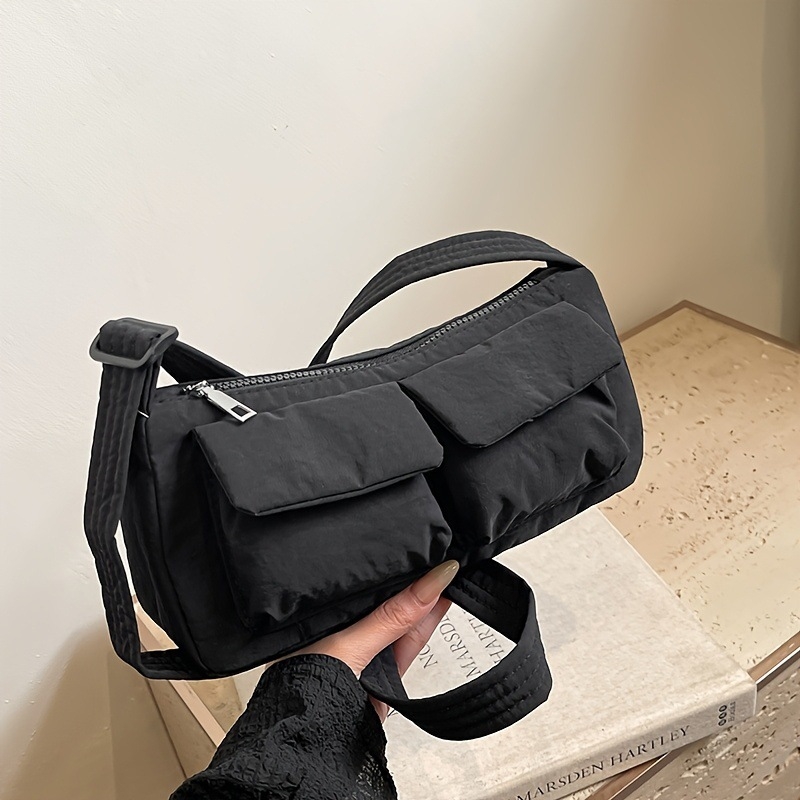 Női nylon crossbody táska, közepes méret, városi minimalistikus stílus, cipzáras záródás, belső nylon bélés, belső cipzáras zseb