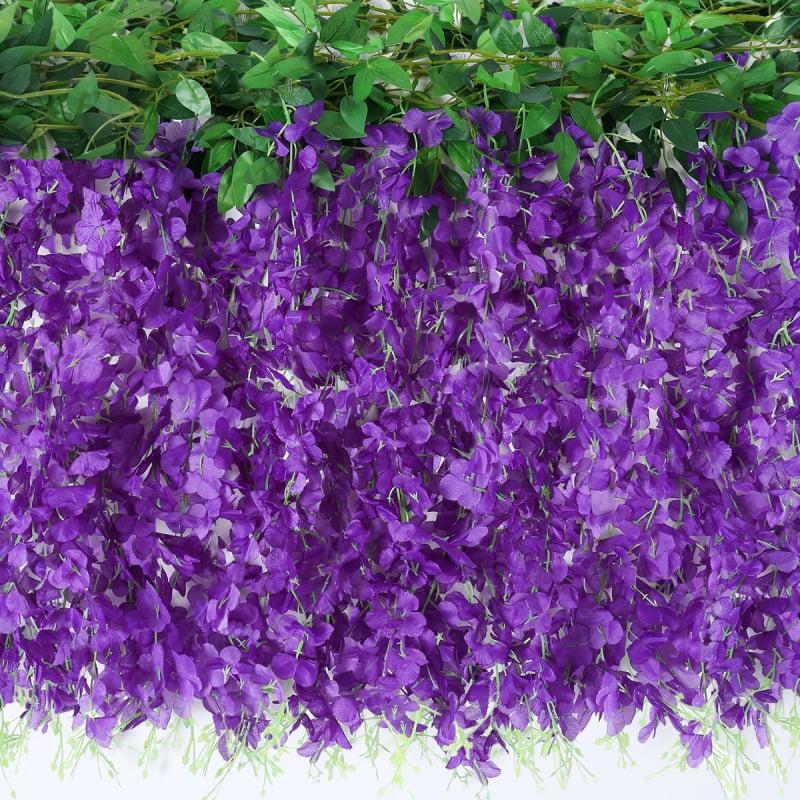 Umelā vistērijas virtene iekšējai dekorācijai; materiāls: plastmasa un zīda ziedi; tehnika: bone shot; šķirne: vistērija; pielietojums: fotorekvizīti, mājas dekorēšana