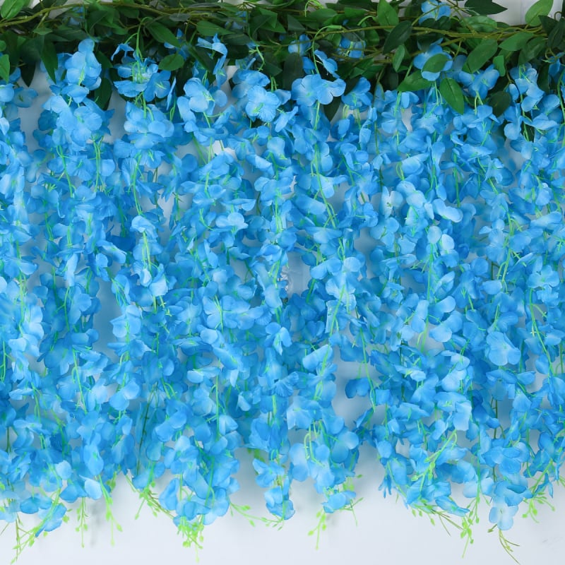 Umelā vistērijas virtene iekšējai dekorācijai; materiāls: plastmasa un zīda ziedi; tehnika: bone shot; šķirne: vistērija; pielietojums: fotorekvizīti, mājas dekorēšana