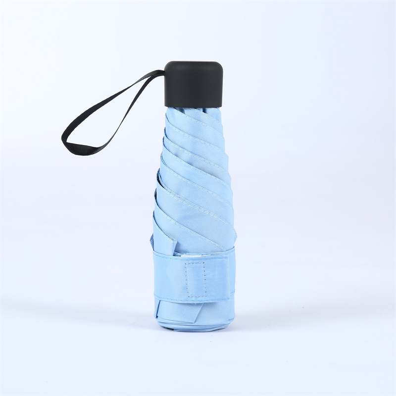 Компактен капсулен чадър, 6 ребра, ръчно отваряне, UPF > 50, плат 210T, железен прът