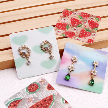 Komi auskarų ekspozicinė kortelė su 400 g vario plokštele, spalvotas spausdinimas, juvelyriniai dirbiniai