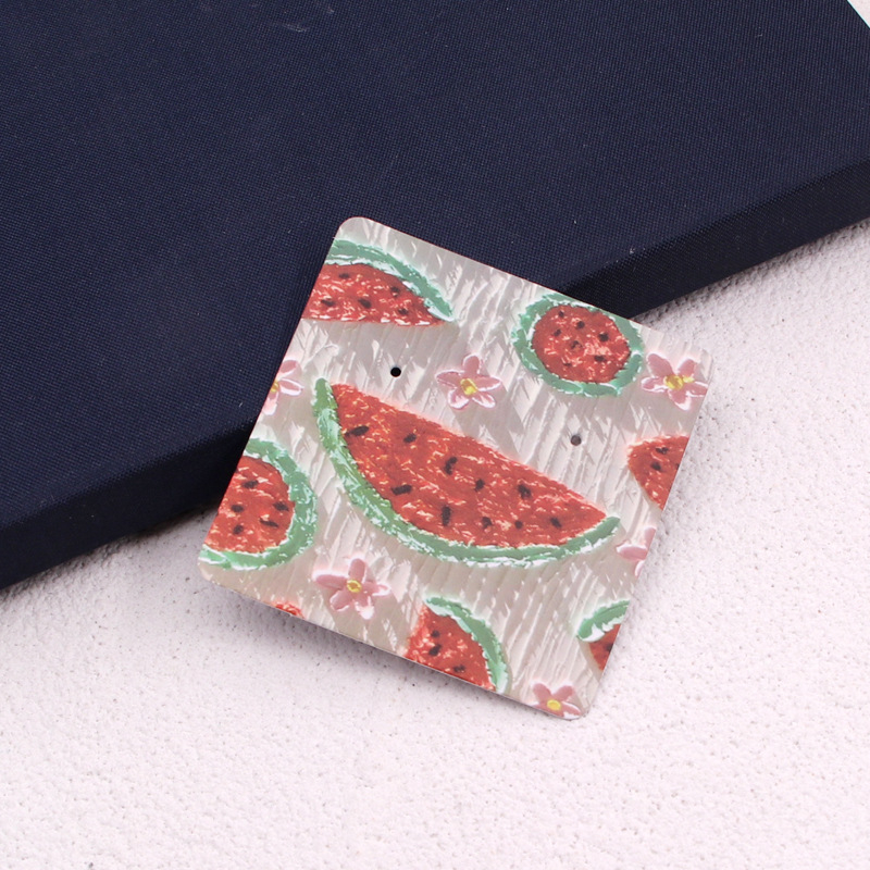 Komi auskarų ekspozicinė kortelė su 400 g vario plokštele, spalvotas spausdinimas, juvelyriniai dirbiniai